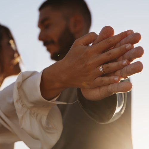 side-view-married-couple-holding-hands